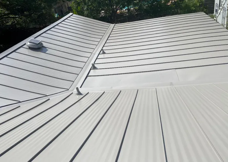 Solar attic fan installed on a metal roof for Roof Ventilation in South Milwaukee